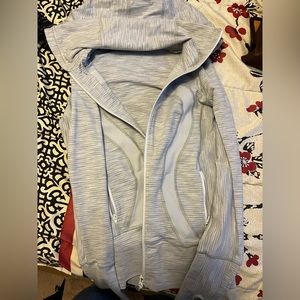 Size 4 Lulu lemon zip up great condition zippers work no stains